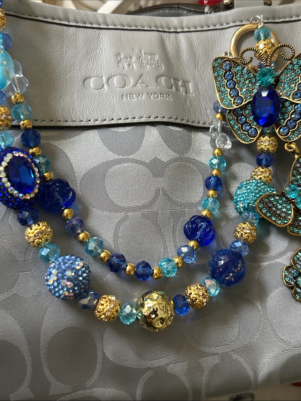 Keychain Blue, Aqua and Gold Beaded Statement Necklace with Butterfly Accent